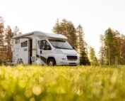 Small RV with lawn chairs